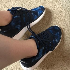 Blue adidas running shoes